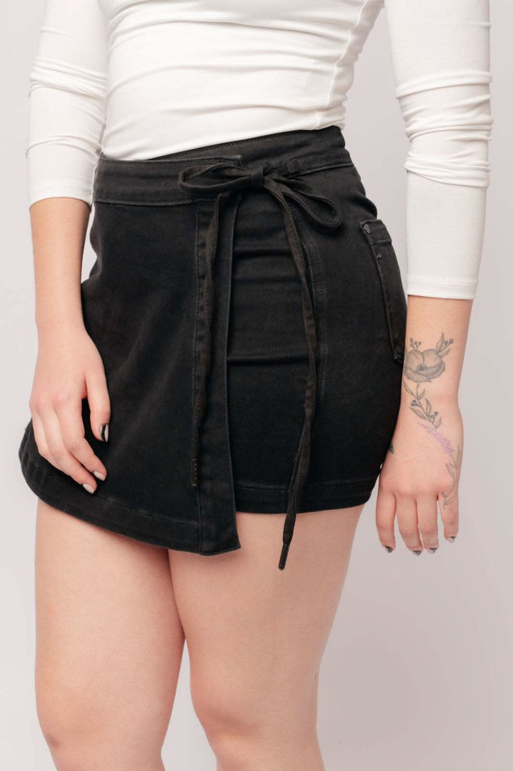 Bentli High Rise Side Tie Denim Skort in Black in - Denim photo