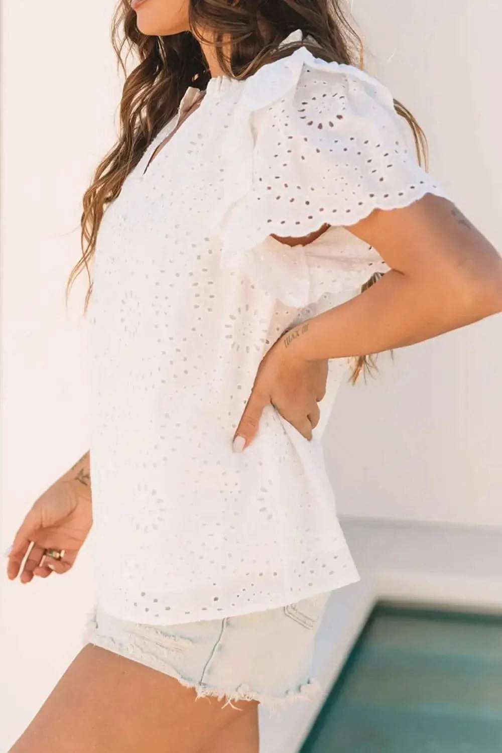 Eyelet Notched Short Sleeve Blouse in - photo