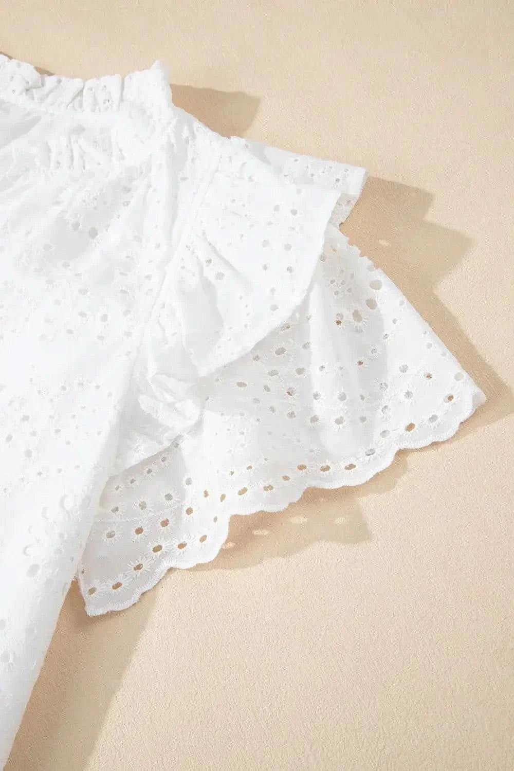 Eyelet Notched Short Sleeve Blouse in - photo