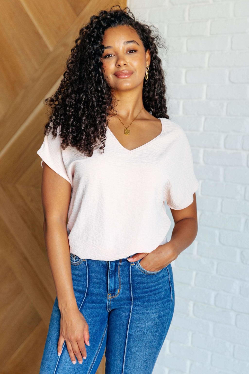 Frequently Asked Questions V-Neck Top in Blush in - Tops photo