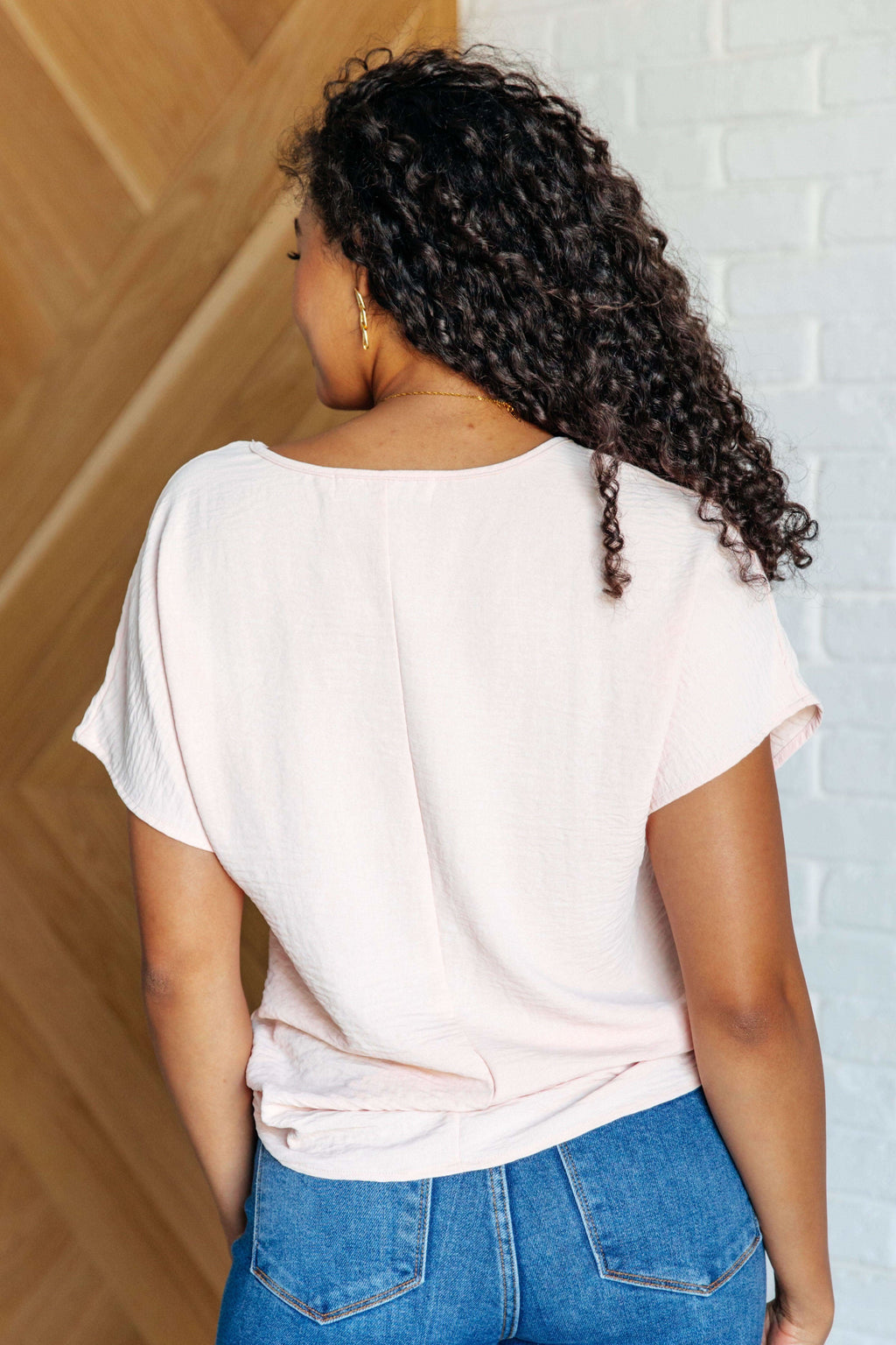 Frequently Asked Questions V-Neck Top in Blush in - Tops photo