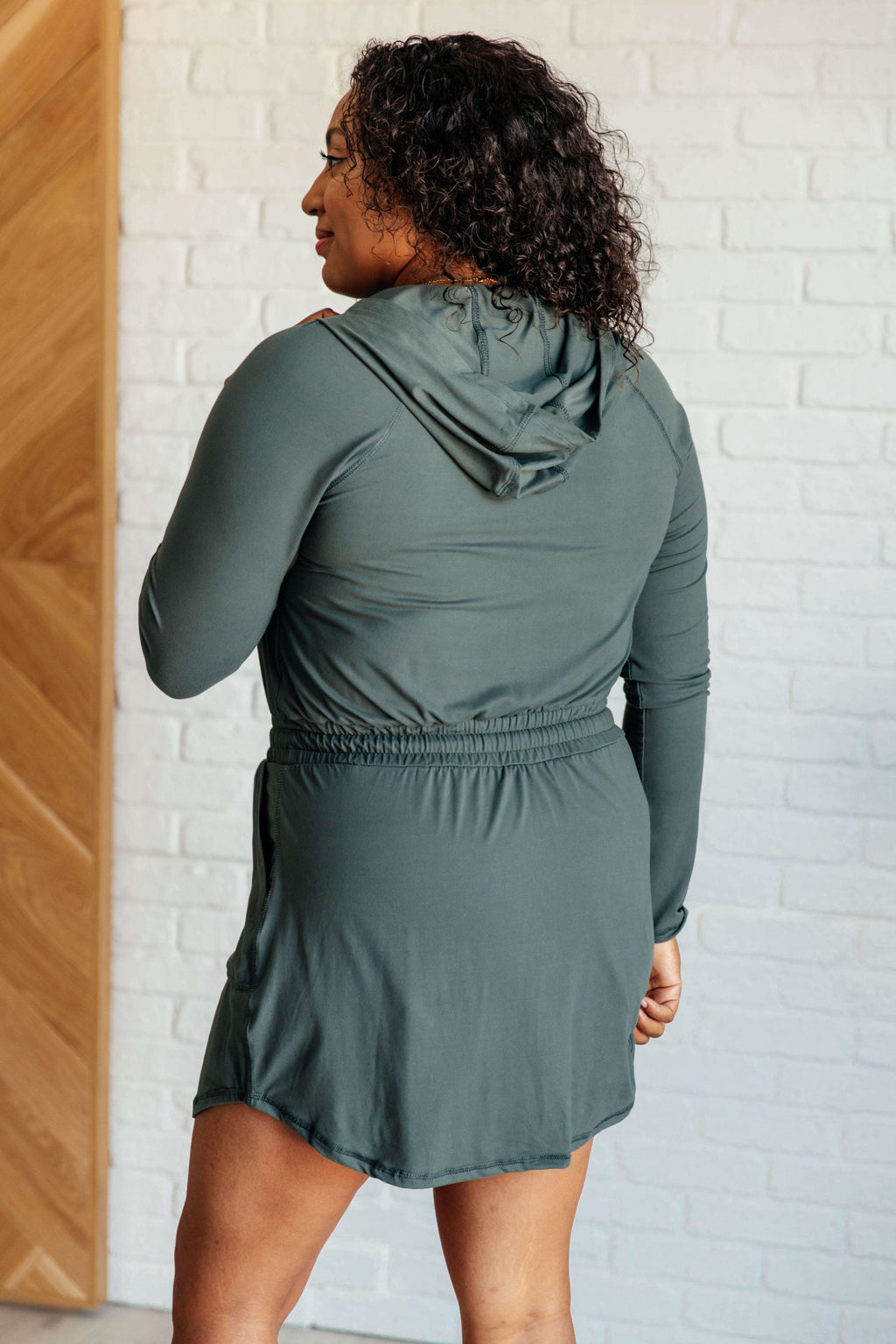Getting Out Long Sleeve Hoodie Romper in Smoked Spruce in - Jumpsuits & Rompers photo