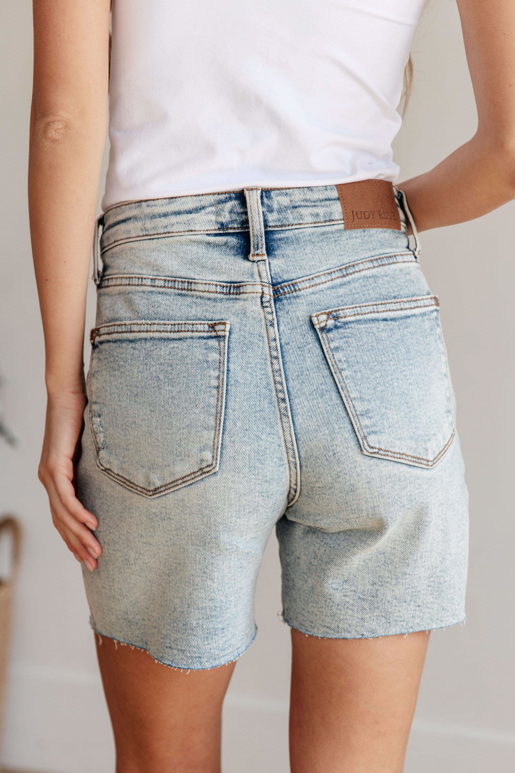 Cindy High Rise Mineral Wash Distressed Boyfriend Shorts in - Denim photo