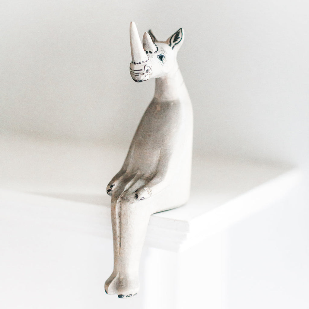 Hand-carved Rhino Shelf Sitter in - Decor photo