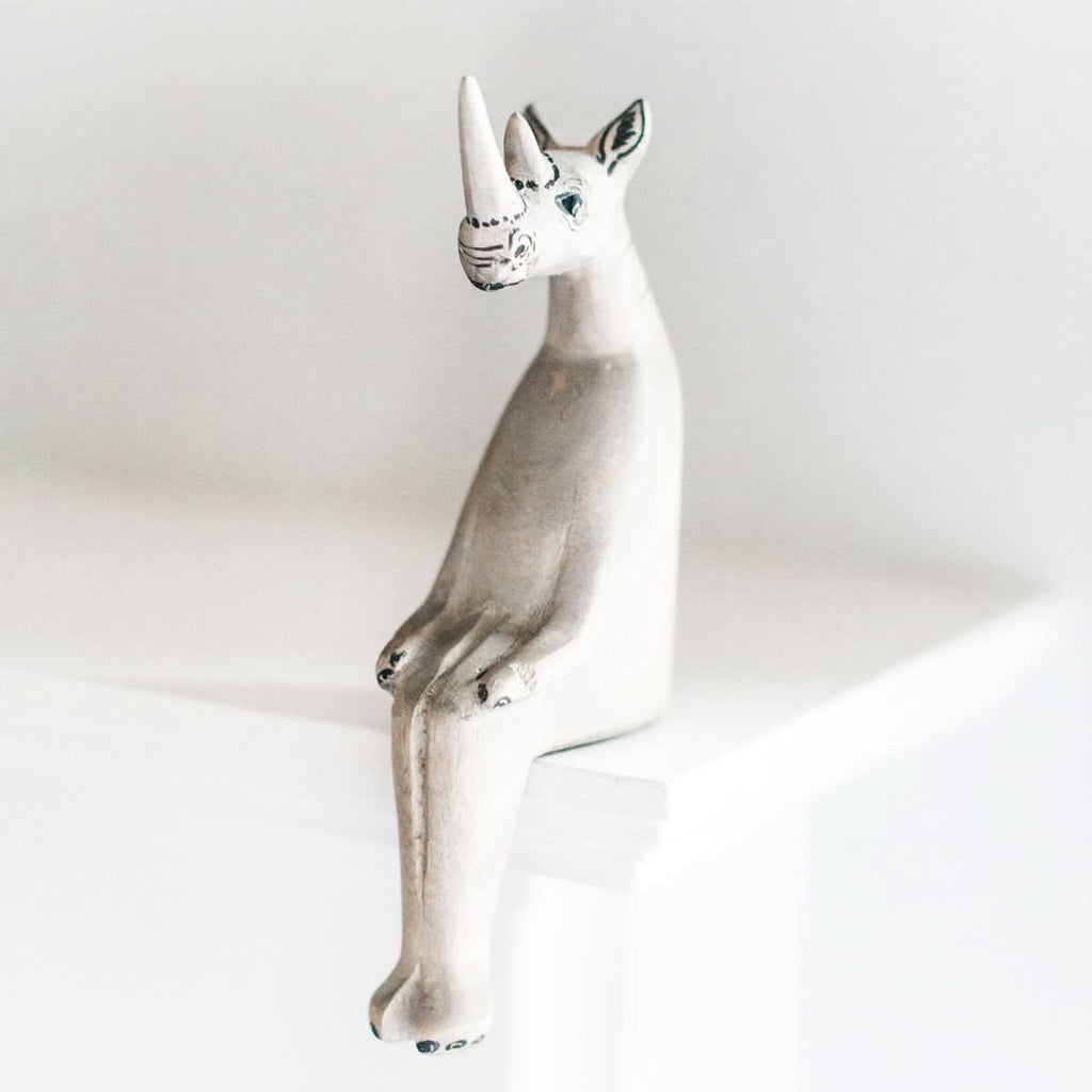 Hand-carved Rhino Shelf Sitter in - Decor photo