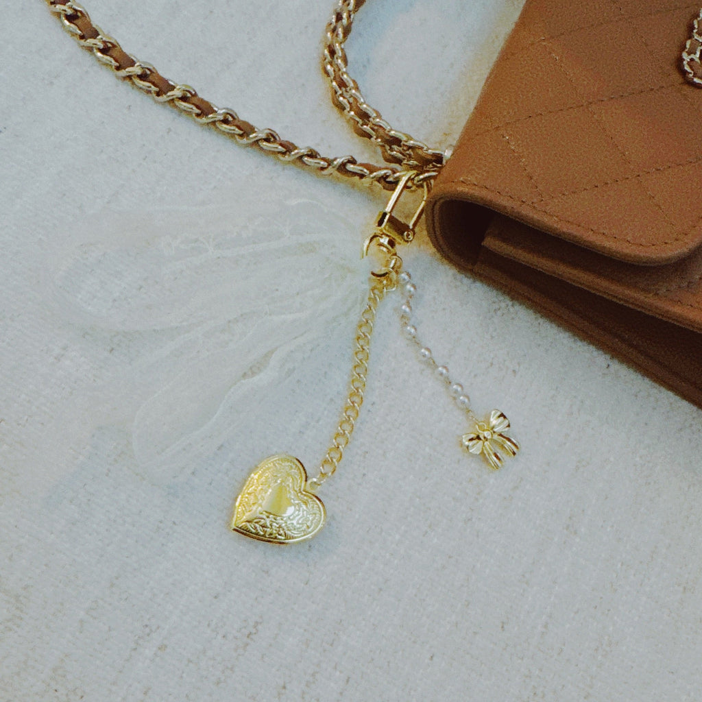 Lace & Love Heart Bag Charm – White Bow with Gold Heart | Romantic Chic in - Jewelry photo