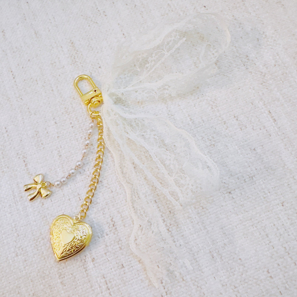 Lace & Love Heart Bag Charm – White Bow with Gold Heart | Romantic Chic in - Jewelry photo