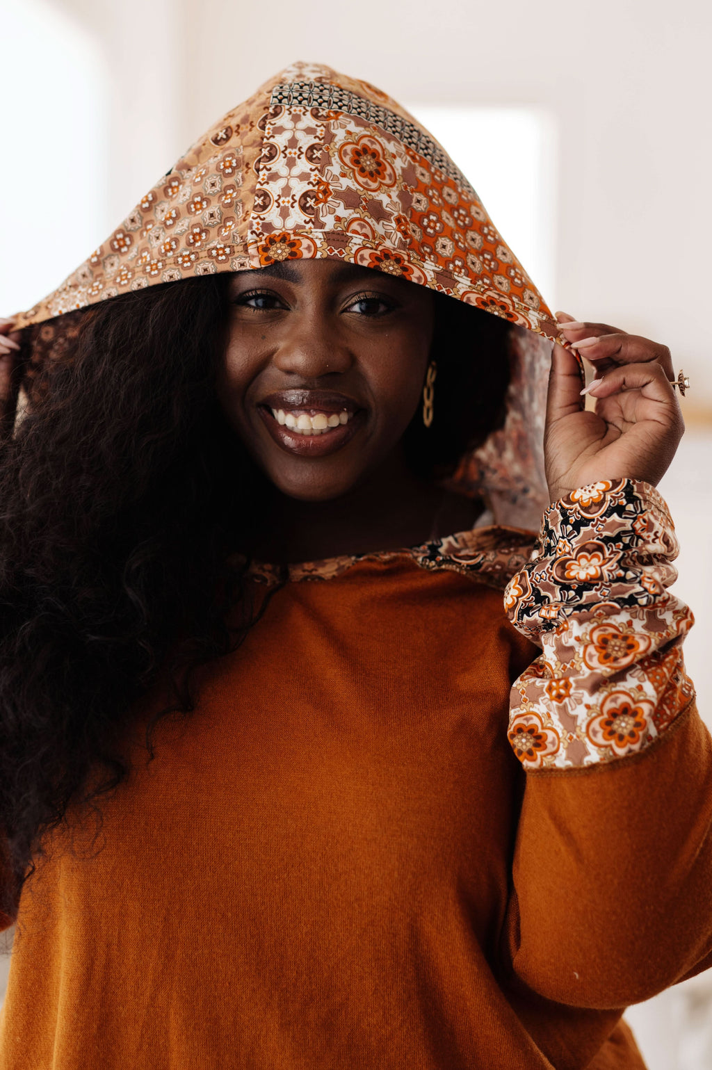 Sipping Iced Tea Mixed Print Hoodie in - Tops photo