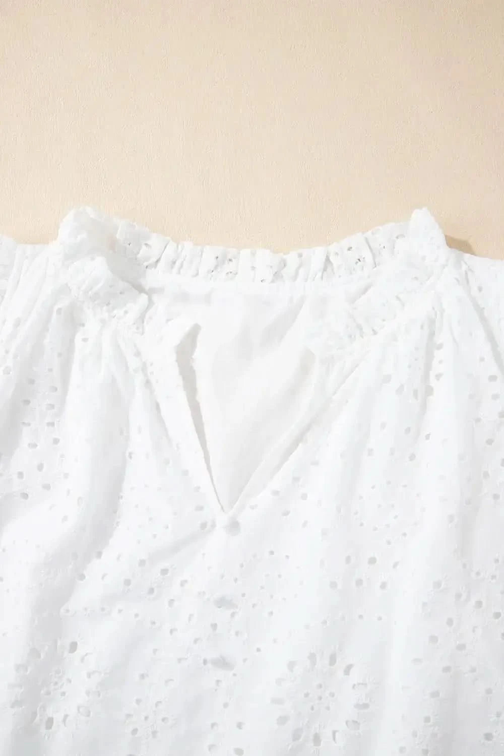 Eyelet Notched Short Sleeve Blouse in - photo