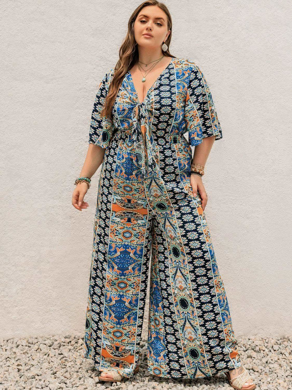 Plus Size Printed Half Sleeve Wide Leg Jumpsuit in Peacock Blue - photo