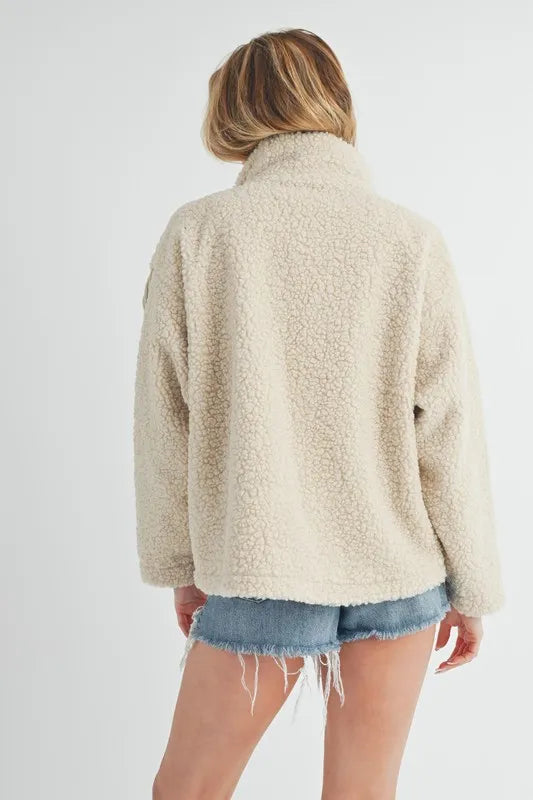 Aemi + Co Fake Two Pieces Turtleneck Sherpa Jacket with Pockets in - photo