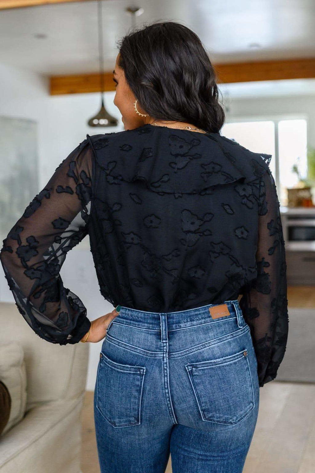 Think Of Me Ruffle Long Sleeve Bodysuit in Black in - Shirts & Tops photo