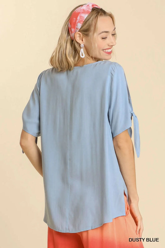 Umgee Cold Shoulder Short Sleeve Round Neck Top with Side Slits and Tie-able Knot Details in - photo