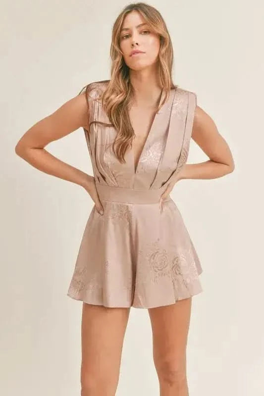MABLE Draped Romper with Pleated Shoulder Pad Detail in - photo