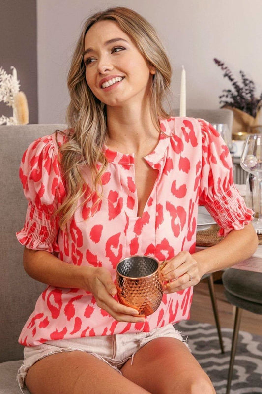 BiBi Leopard Smocked Short Sleeve Blouse in Peach Coral - photo