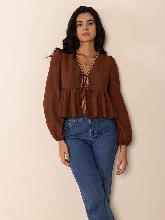 Peplum Tied V-Neck Long Sleeve Blouse in Brown - photo