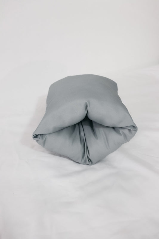 Lagoon Wipeable Cradle Arm Pillow in - photo