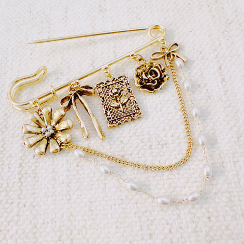Floral Ribbon Pin Brooch – Elegant Gold Safety Pin with Charms and Pearl Chains in - Fashion Accessories photo