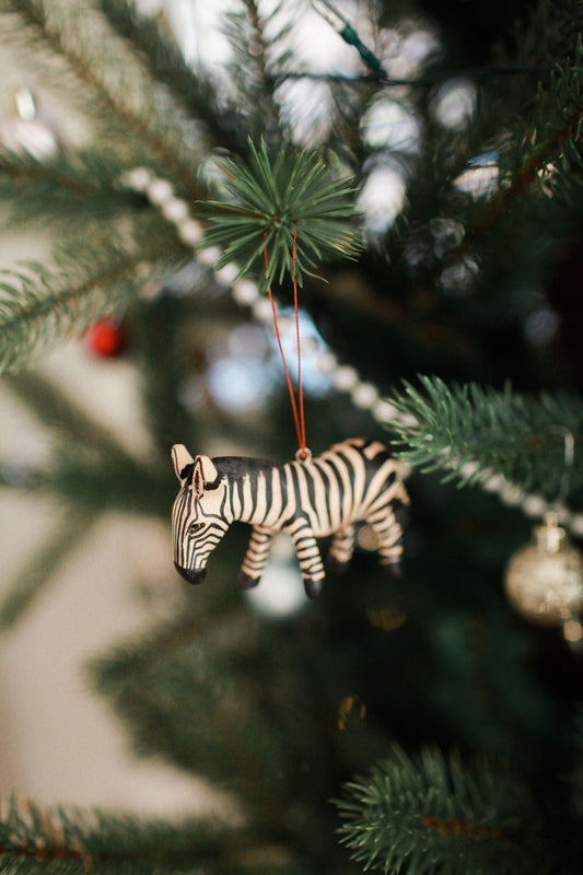 Hand-Carved Zebra Ornament in - photo