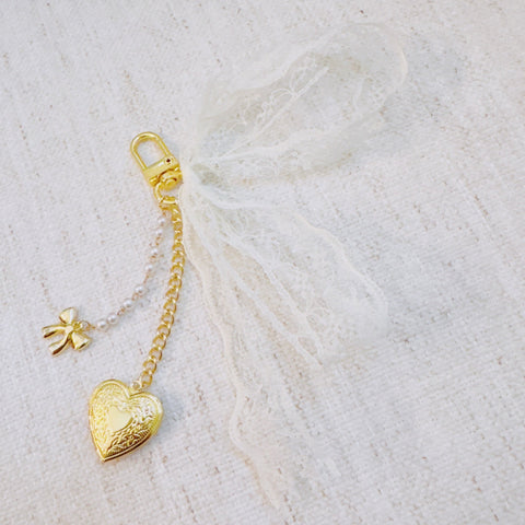 Lace & Love Heart Bag Charm – White Bow with Gold Heart | Romantic Chic in - Jewelry photo