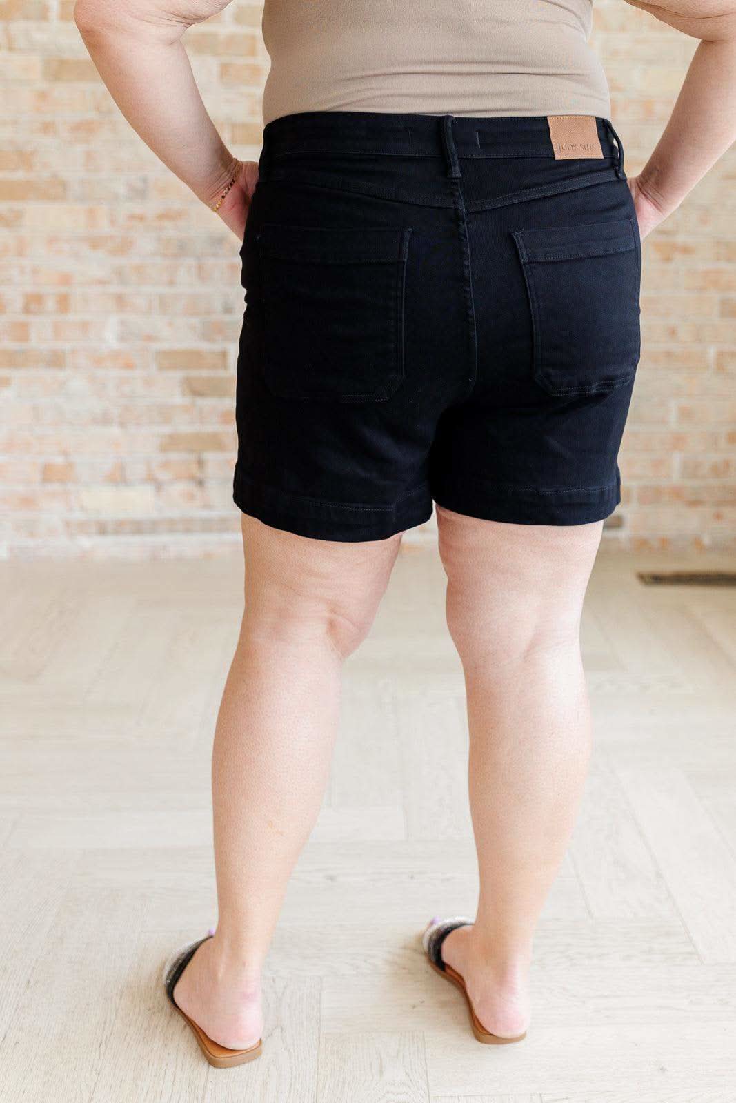 Reagan High Rise Button Fly Trouser Shorts in - Denim photo