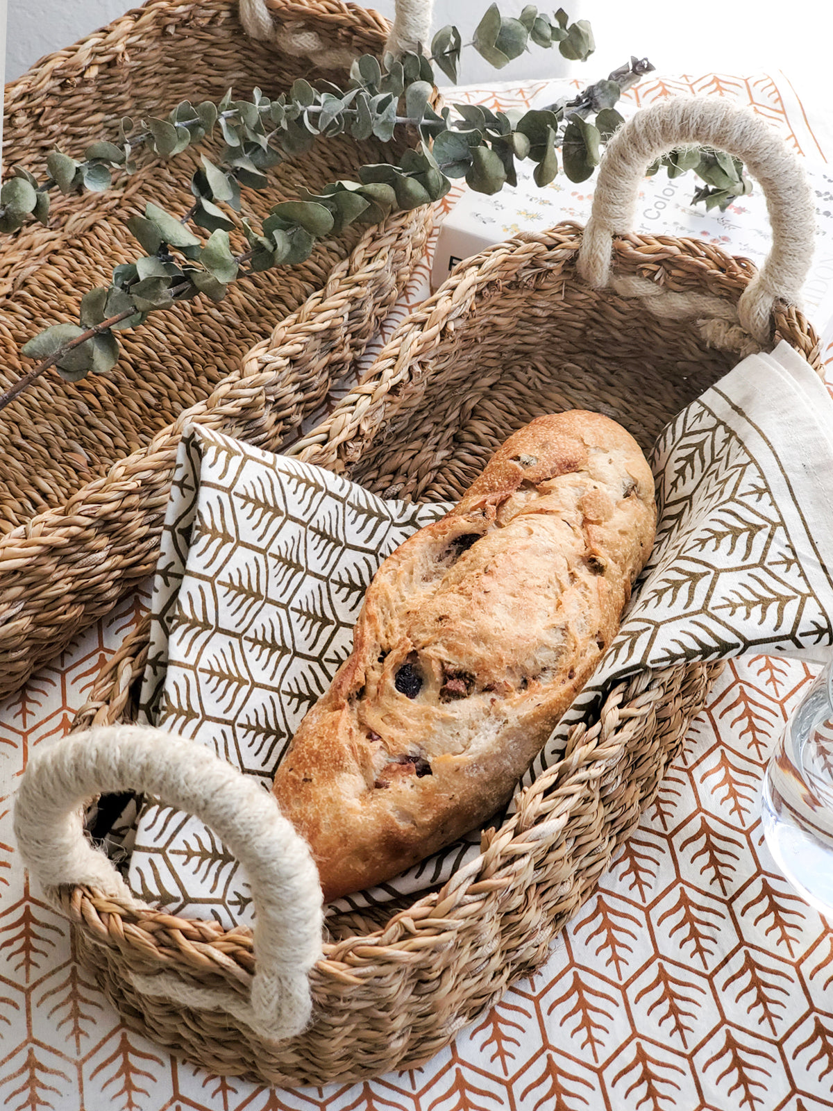 KORISSA Savar Bread Basket with White Handle in - Storage & Organization photo