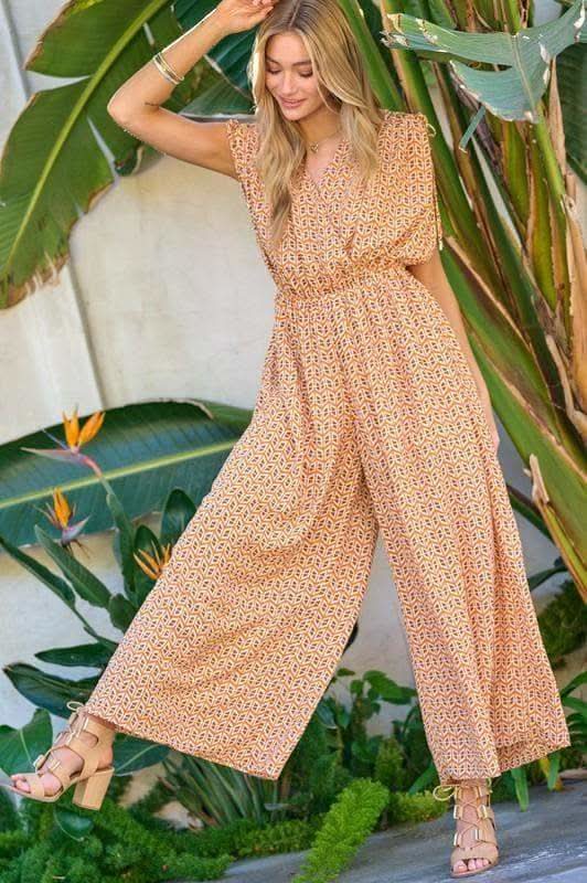 DAVI & DANI Printed V Neck Sleeveless Jumpsuit in Orange - Jumpsuits & Rompers photo