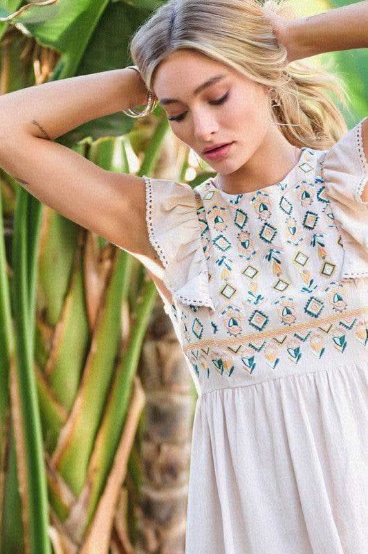 DAVI & DANI Solid Round Neck Embroidered Mini Dress in - Dresses photo