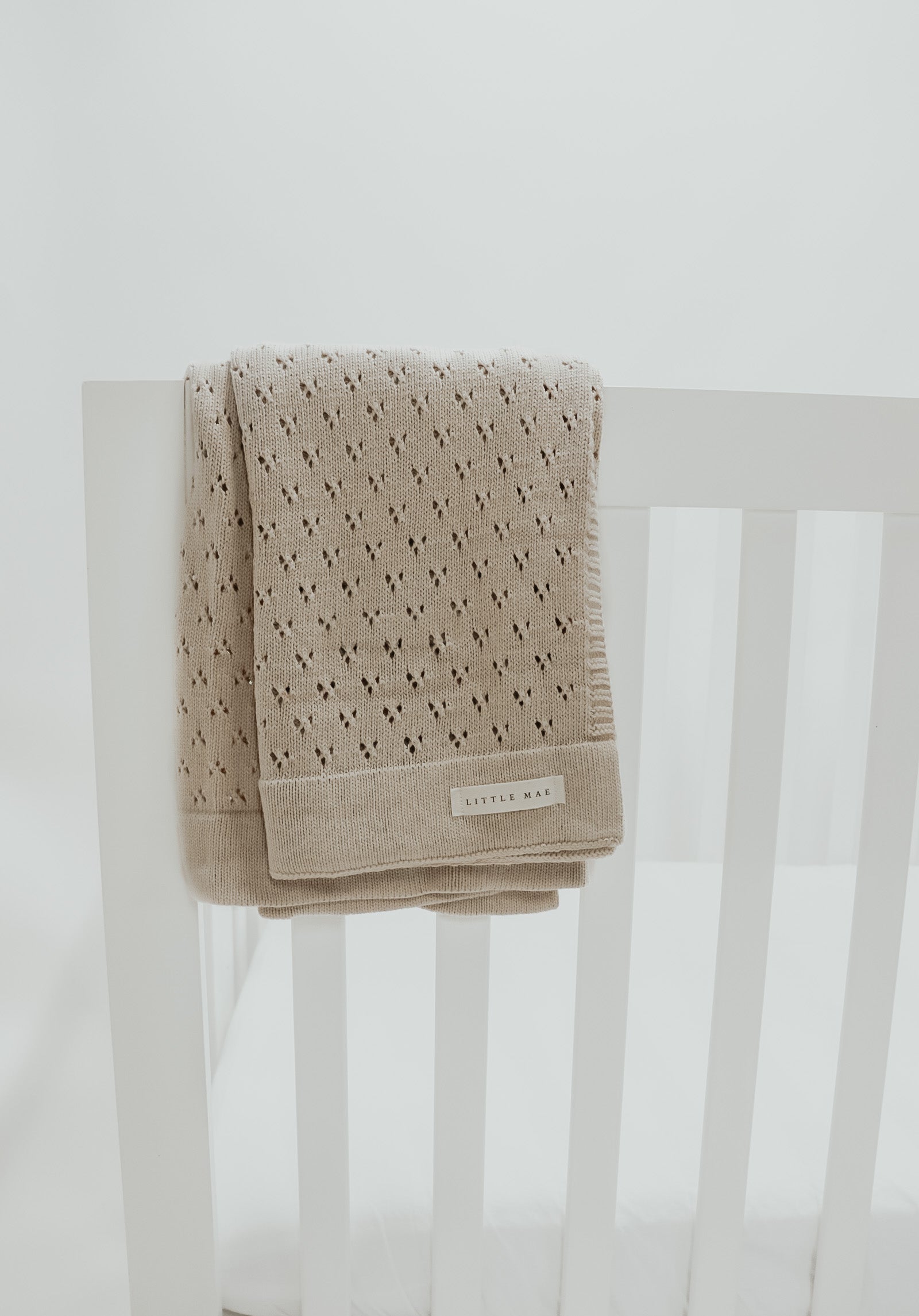 Little Mae & Co. Toffee Pointelle Knit Blanket in - photo