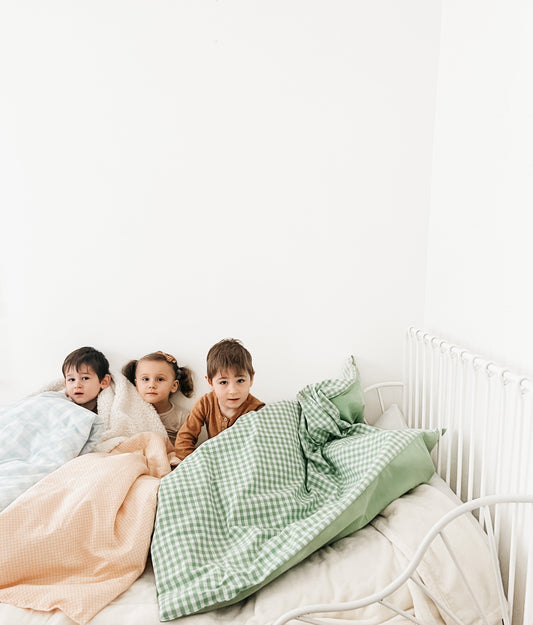 Ivy Gingham Quilted Blanket in - photo