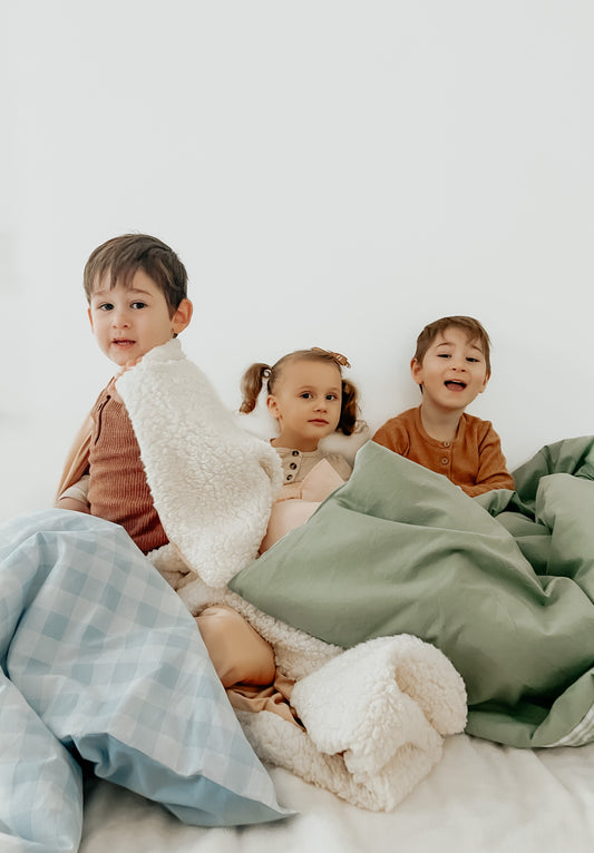 Marine Checkered Quilted Blanket in - photo