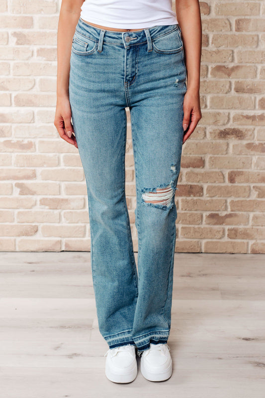 Judy Blue Isla Mid Rise Distressed Released Hem Bootcut Jeans in - Jeans photo
